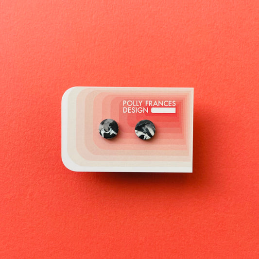 Black and White Studs Sitting On Branded Polly Frances Design Card