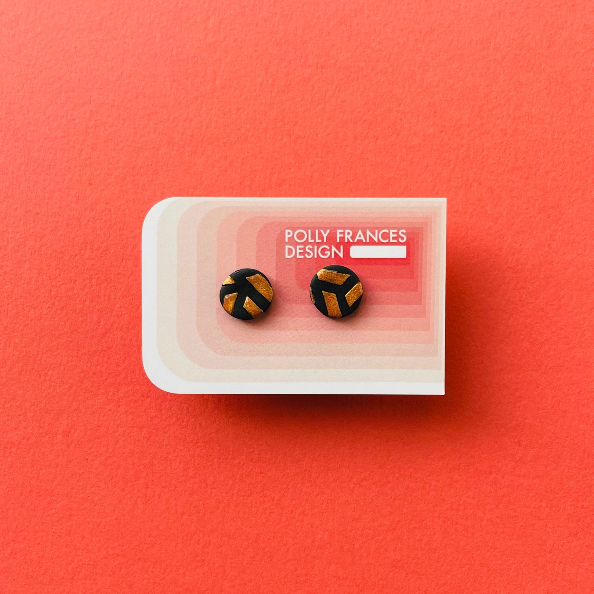 Black and Gold Studs Sitting On Branded Polly Frances Design Card