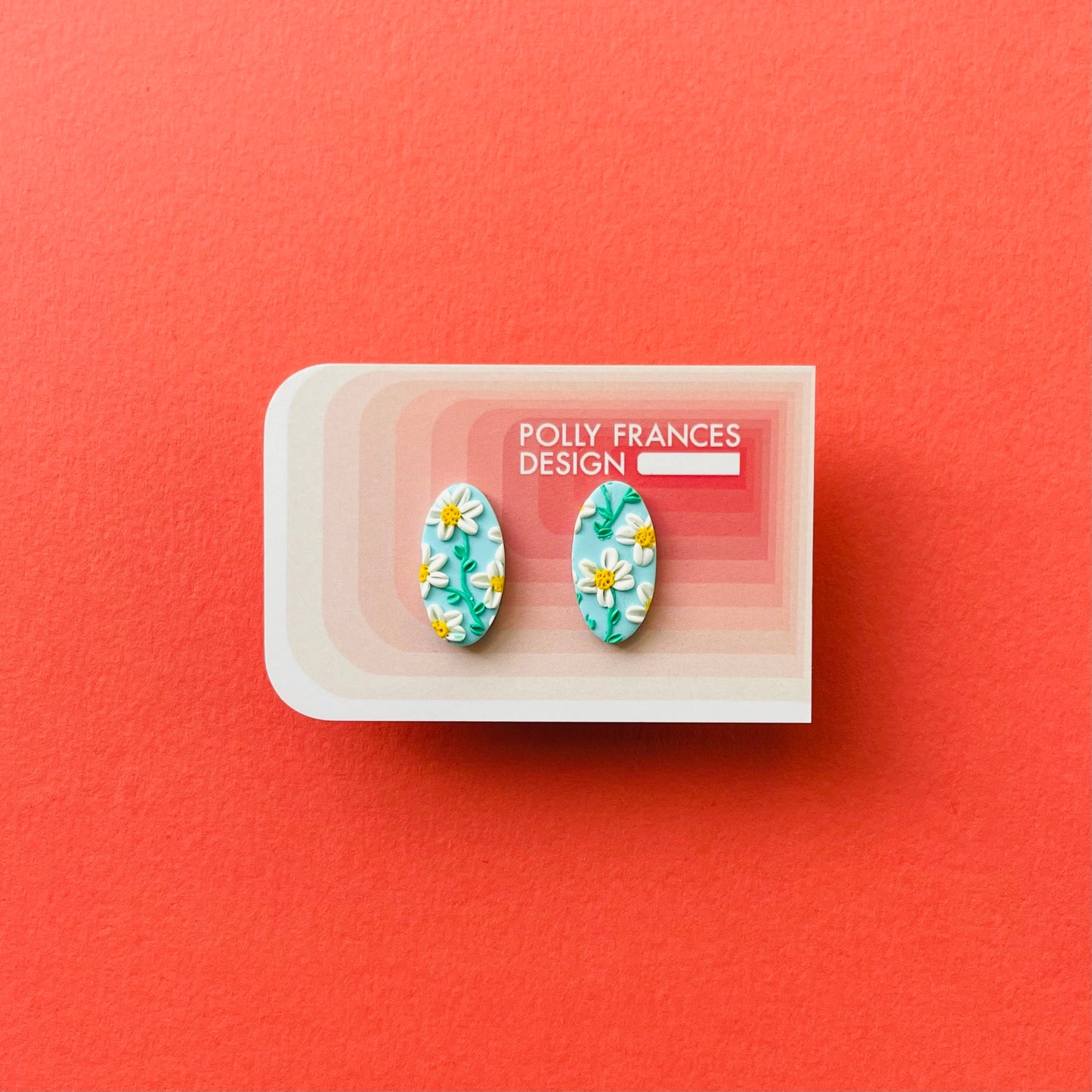 Daisy in Sky Blue Studs Sitting On Branded Polly Frances Design Card