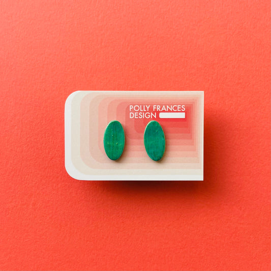 Green Studs Sitting On Branded Polly Frances Design Card