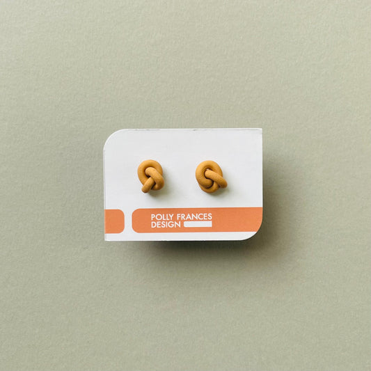 Tan Knot Studs Sitting On Branded Polly Frances Design Card